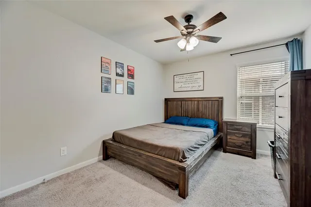 a bedroom with a bed and window