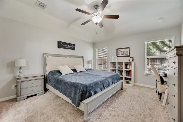 a bedroom with a bed and dresser