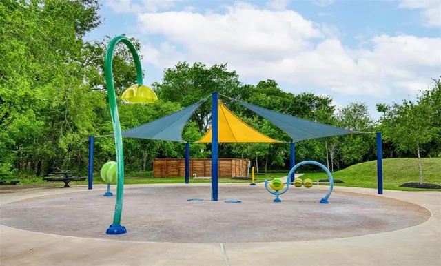 a view of a swimming pool with a deck and a big yard
