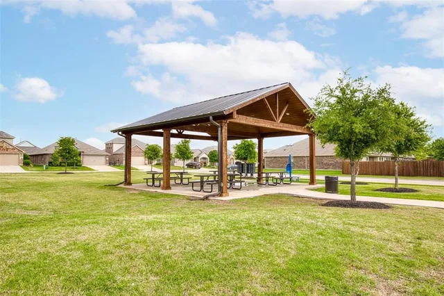 a view of a park with swings