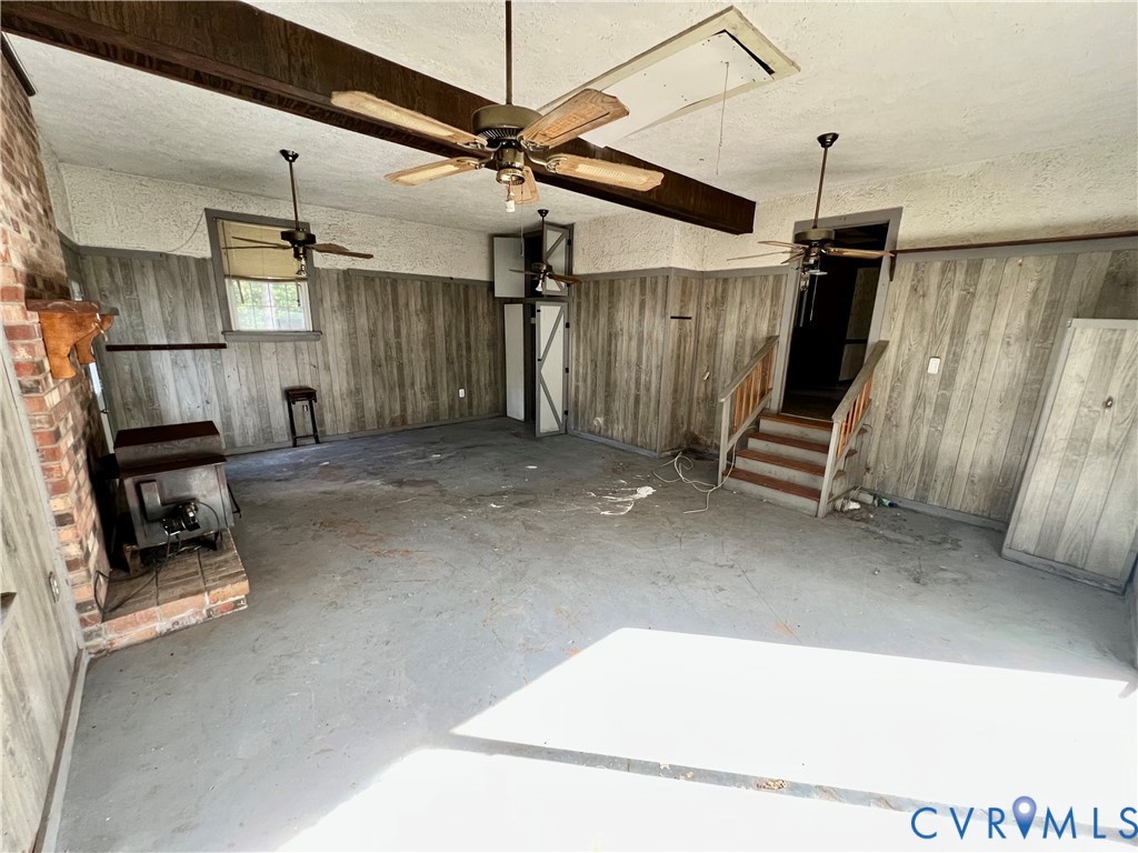 17406 Sandy Ford Road Chesterfield, VA 23838 - Photo 12 of 23 a view of an empty room with wooden floor and a ceiling fan