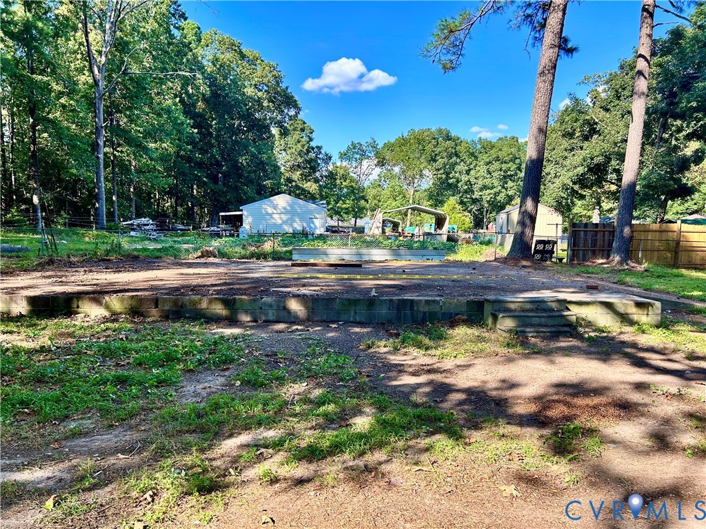 17406 Sandy Ford Road Chesterfield, VA 23838 - Photo 23 of 23 a view of swimming pool with lawn chairs and plants