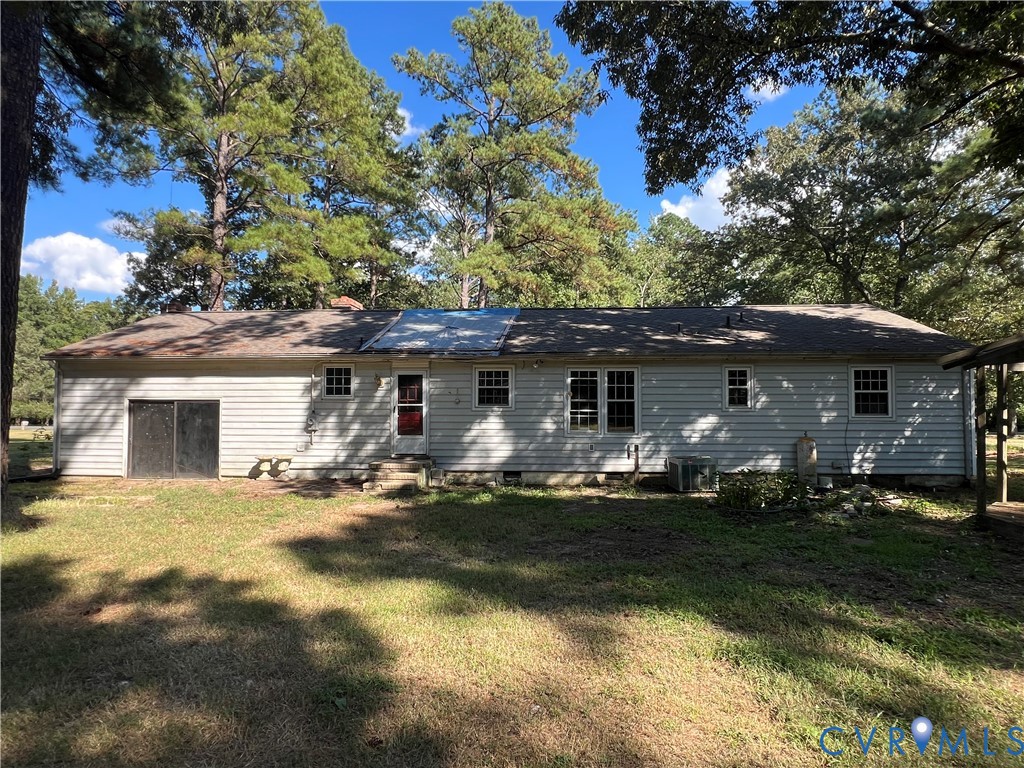 17406 Sandy Ford Road Chesterfield, VA 23838 - Photo 4 of 23 a front view of house with yard and trees in the background