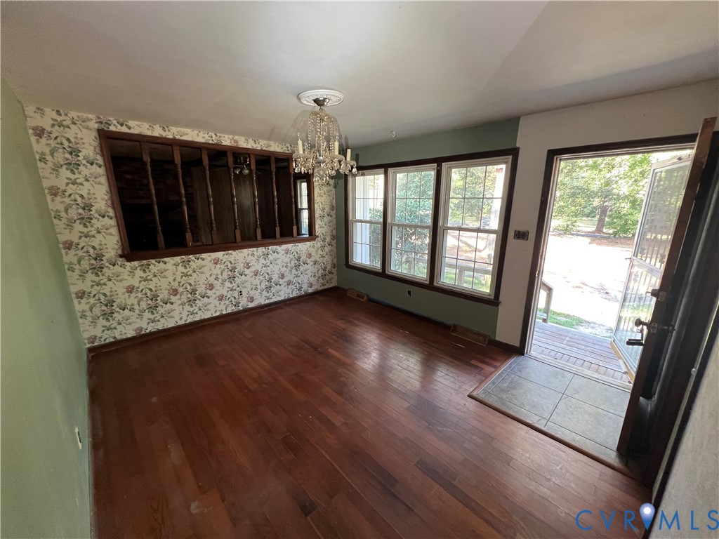 17406 Sandy Ford Road Chesterfield, VA 23838 - Photo 6 of 23 a view of hallway with wooden floor and fireplace