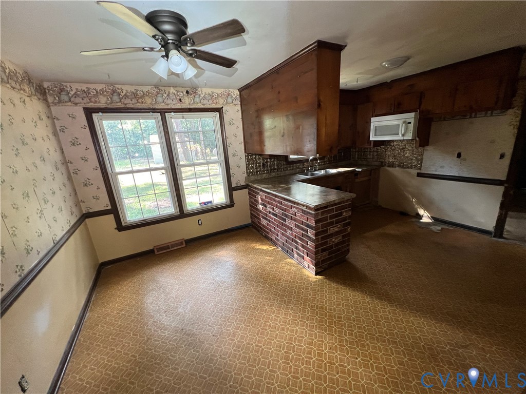 17406 Sandy Ford Road Chesterfield, VA 23838 - Photo 7 of 23 a living room with furniture and a flat screen tv