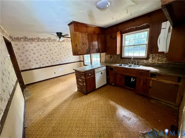 a spacious bathroom with a tub sink and mirror