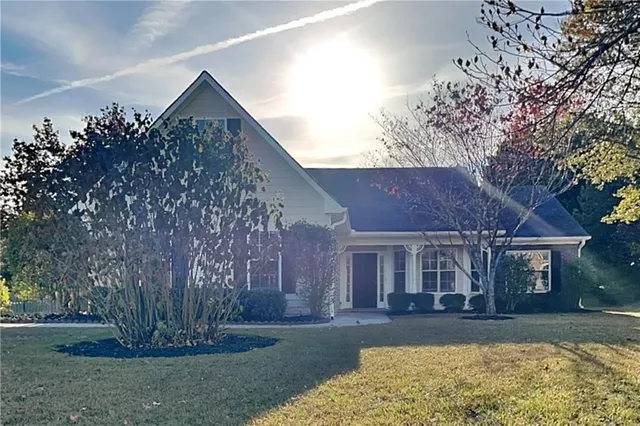 front view of a house with a yard