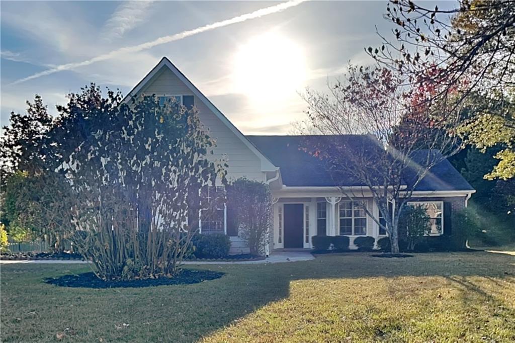 front view of a house with a yard