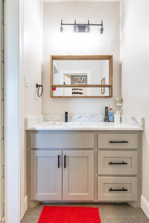 296 Mesquite Ridge Lane Lawn, TX 79530 - Photo 17 of 35 a bathroom with a sink and a mirror
