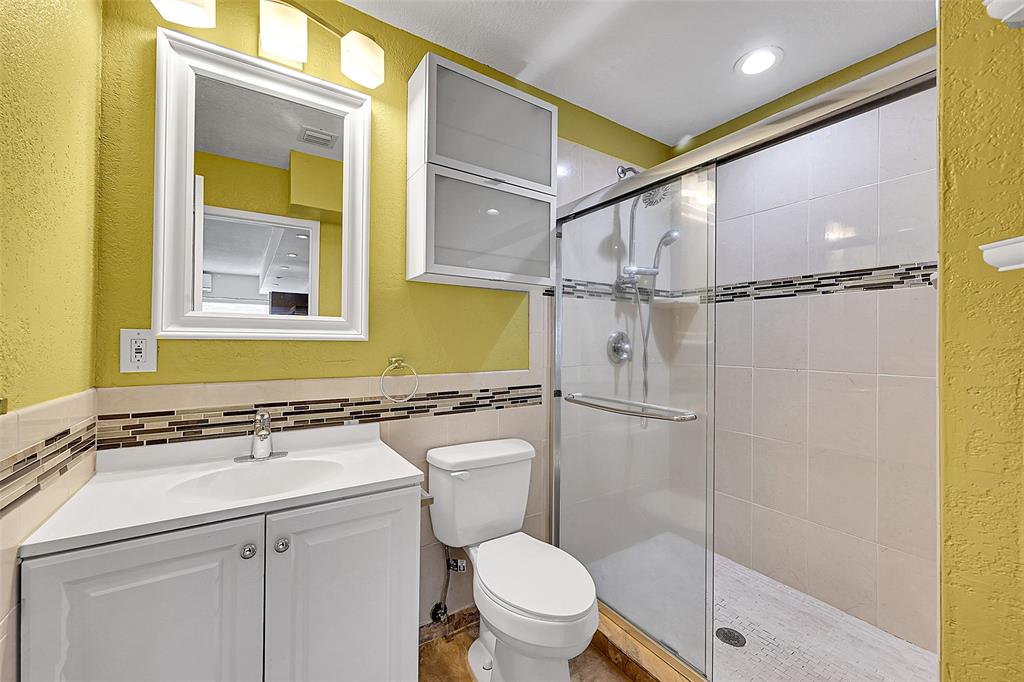 1480 Southwest 66th Terrace Plantation, FL 33317 - Photo 45 of 73 a bathroom with a sink a toilet and shower