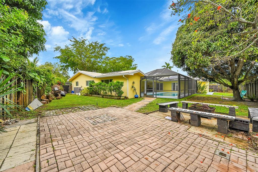 1480 Southwest 66th Terrace Plantation, FL 33317 - Photo 56 of 73 a front view of a house with a yard