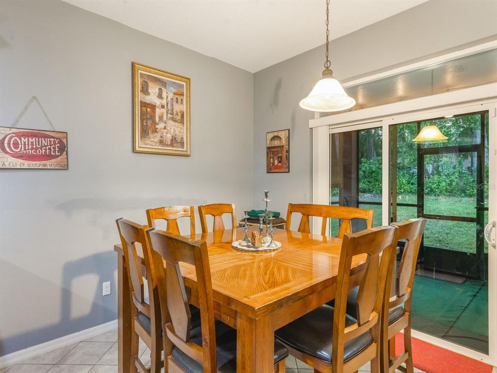 925 Counts Crest Circle Apopka, FL 32712 - Photo 16 of 36 a view of a dining room with furniture window and outside view