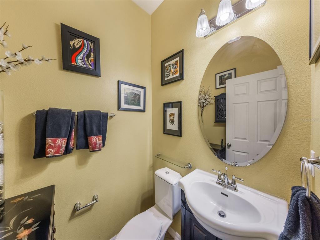 925 Counts Crest Circle Apopka, FL 32712 - Photo 20 of 36 a bathroom with a sink mirror and toilet