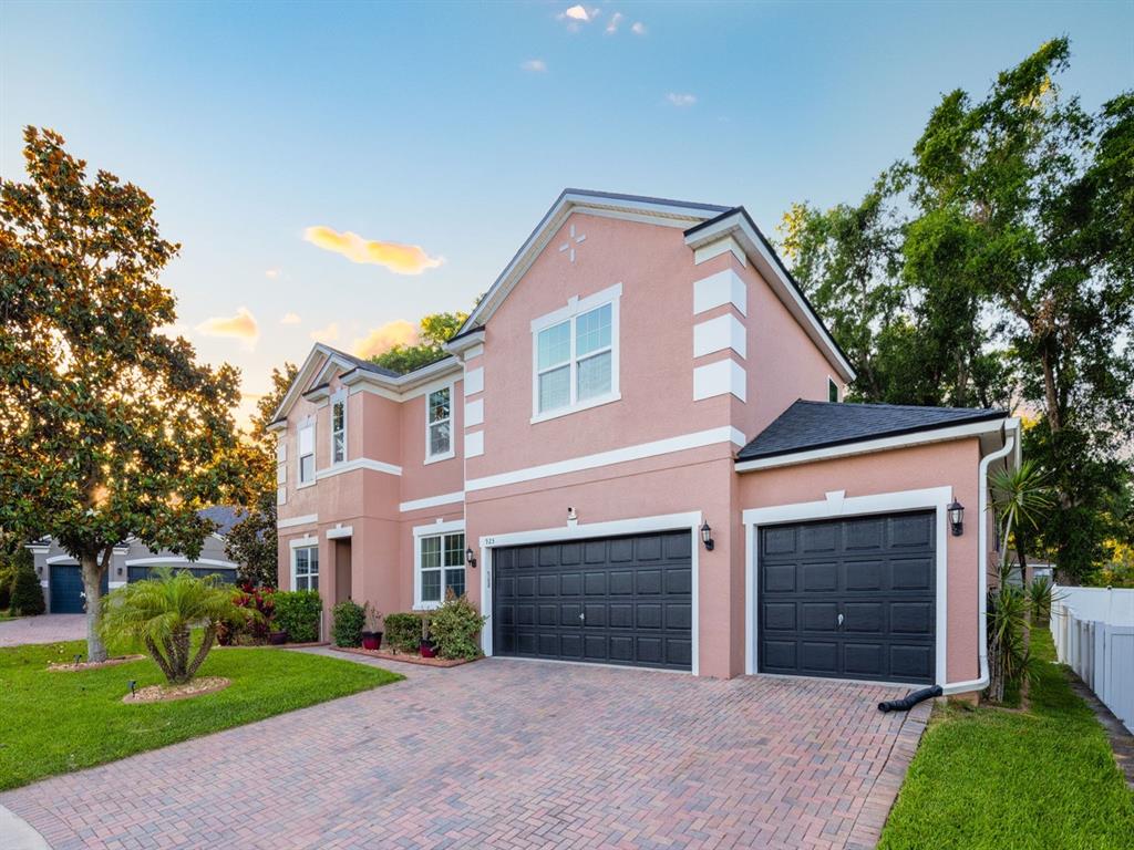 925 Counts Crest Circle Apopka, FL 32712 - Photo 2 of 36 a front view of a house with a yard and garage