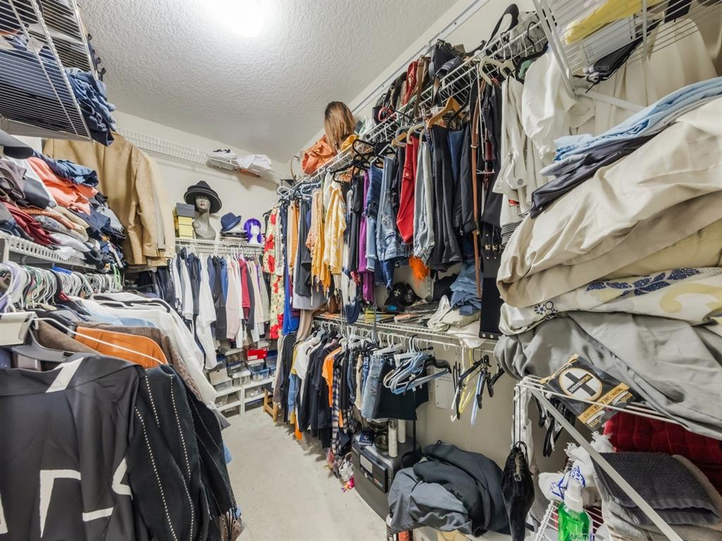 925 Counts Crest Circle Apopka, FL 32712 - Photo 26 of 36 a view of walk in closet with clothes