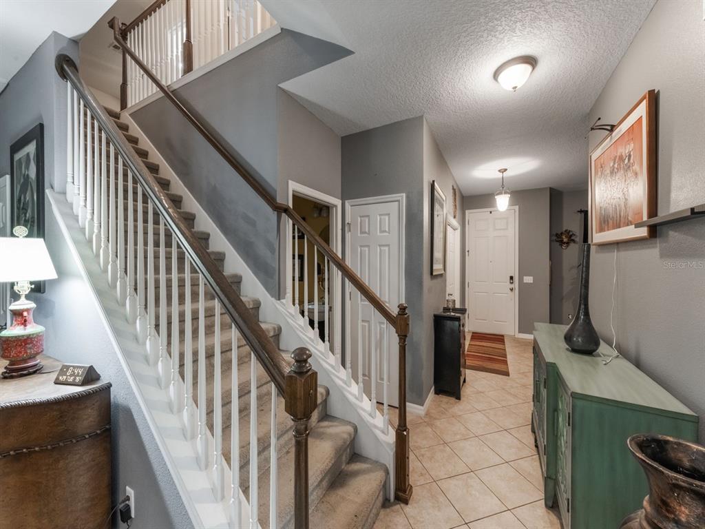 925 Counts Crest Circle Apopka, FL 32712 - Photo 27 of 36 a view of hallway with stairs and wooden floor