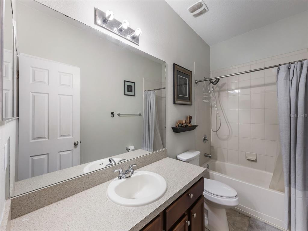 925 Counts Crest Circle Apopka, FL 32712 - Photo 35 of 36 a bathroom with a sink toilet tub and shower