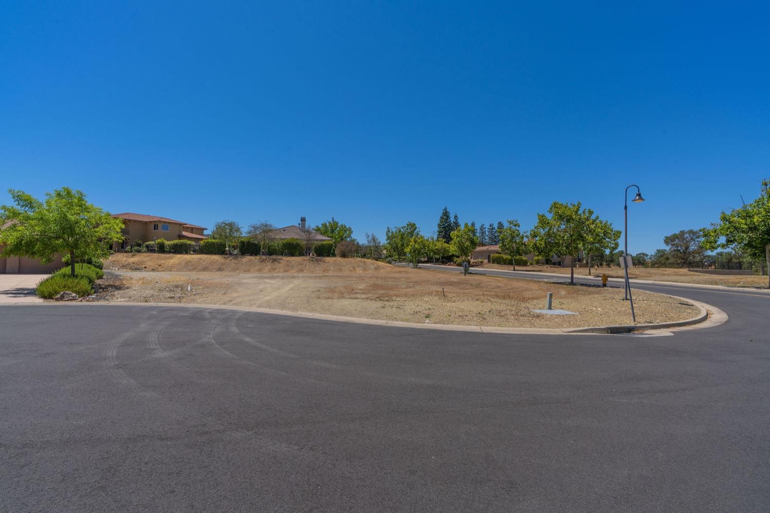 10 Flagstone Court, Unit 1 COPPER RIDGE 32 Copperopolis, CA 95228 - Photo 12 of 31 a view of a road and a building in the background