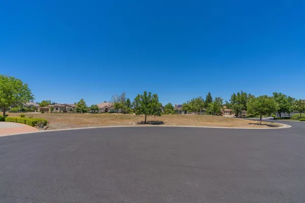 a view of a road with a building in the background