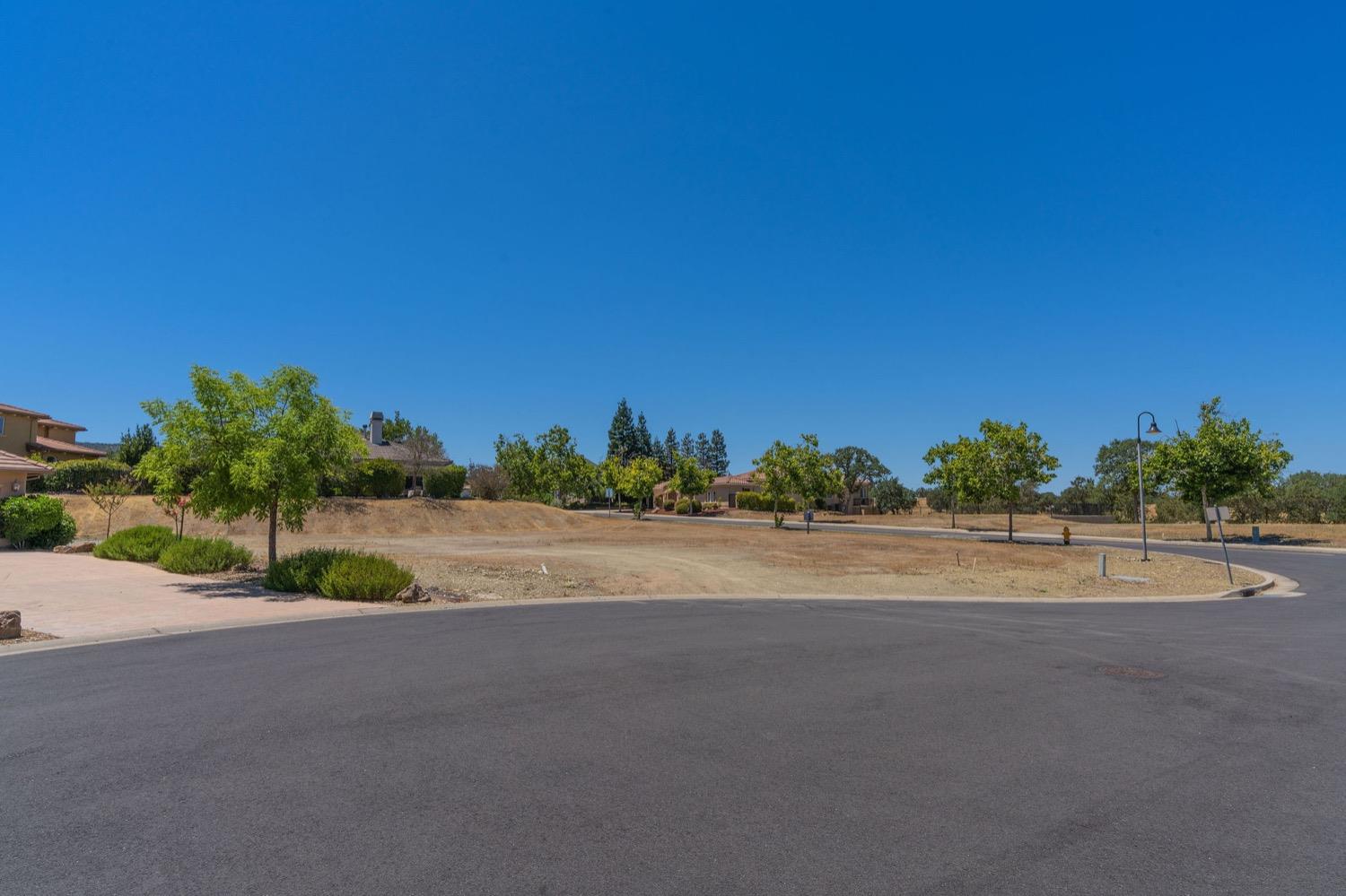 10 Flagstone Court, Unit 1 COPPER RIDGE 32 Copperopolis, CA 95228 - Photo 16 of 31 a view of a road with a building in the background