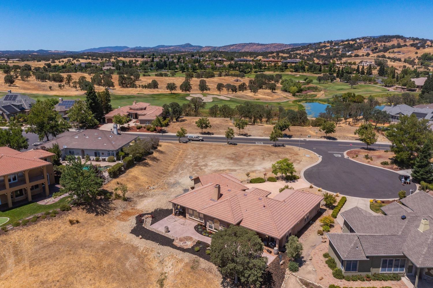 10 Flagstone Court, Unit 1 COPPER RIDGE 32 Copperopolis, CA 95228 - Photo 2 of 31 a view of a lake with a mountain