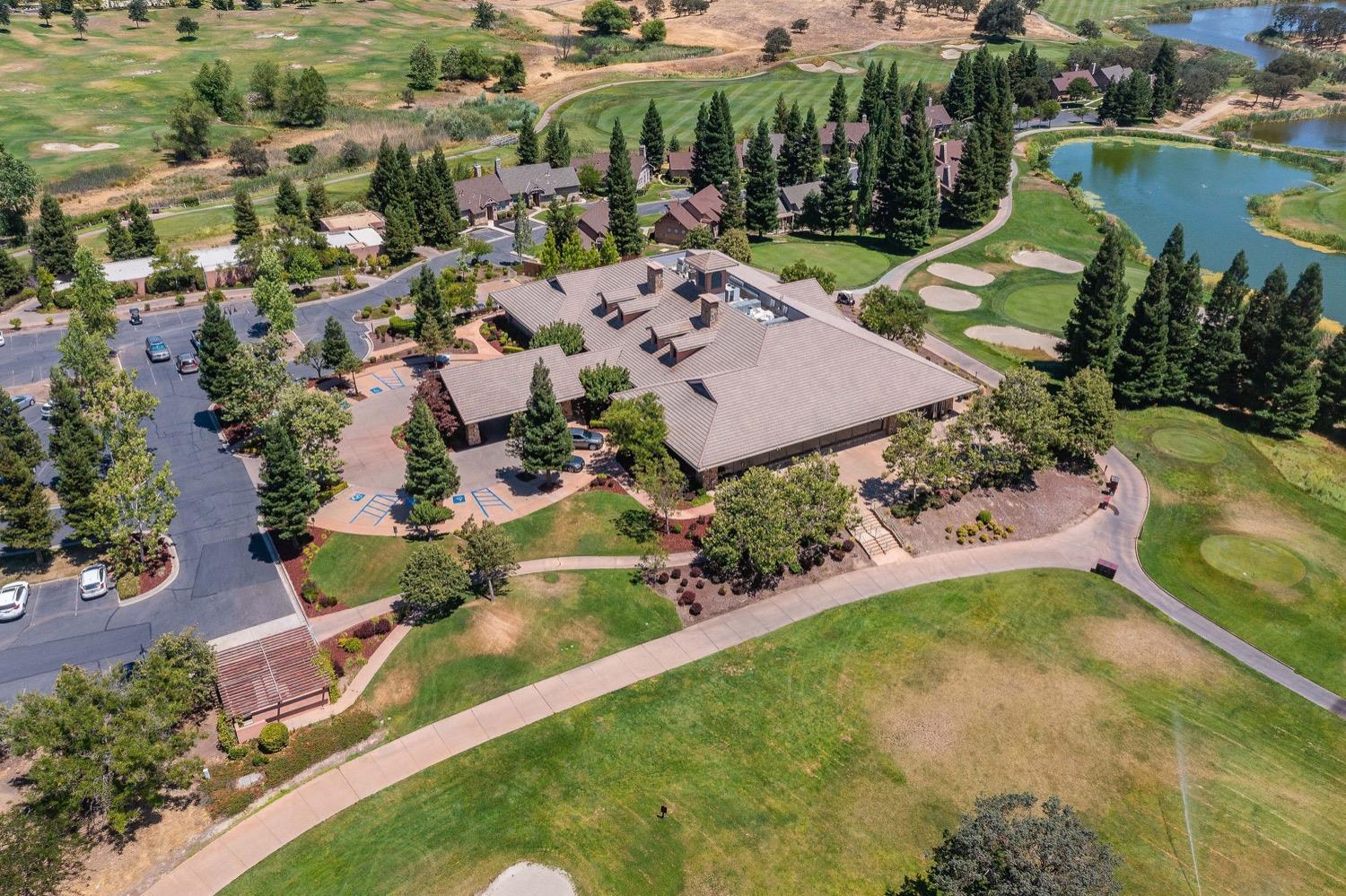 10 Flagstone Court, Unit 1 COPPER RIDGE 32 Copperopolis, CA 95228 - Photo 29 of 31 an aerial view of a house with a garden and lake view