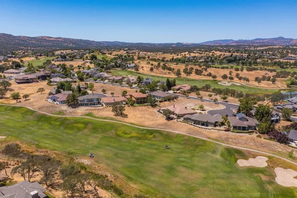 a view of a city with mountains in the background