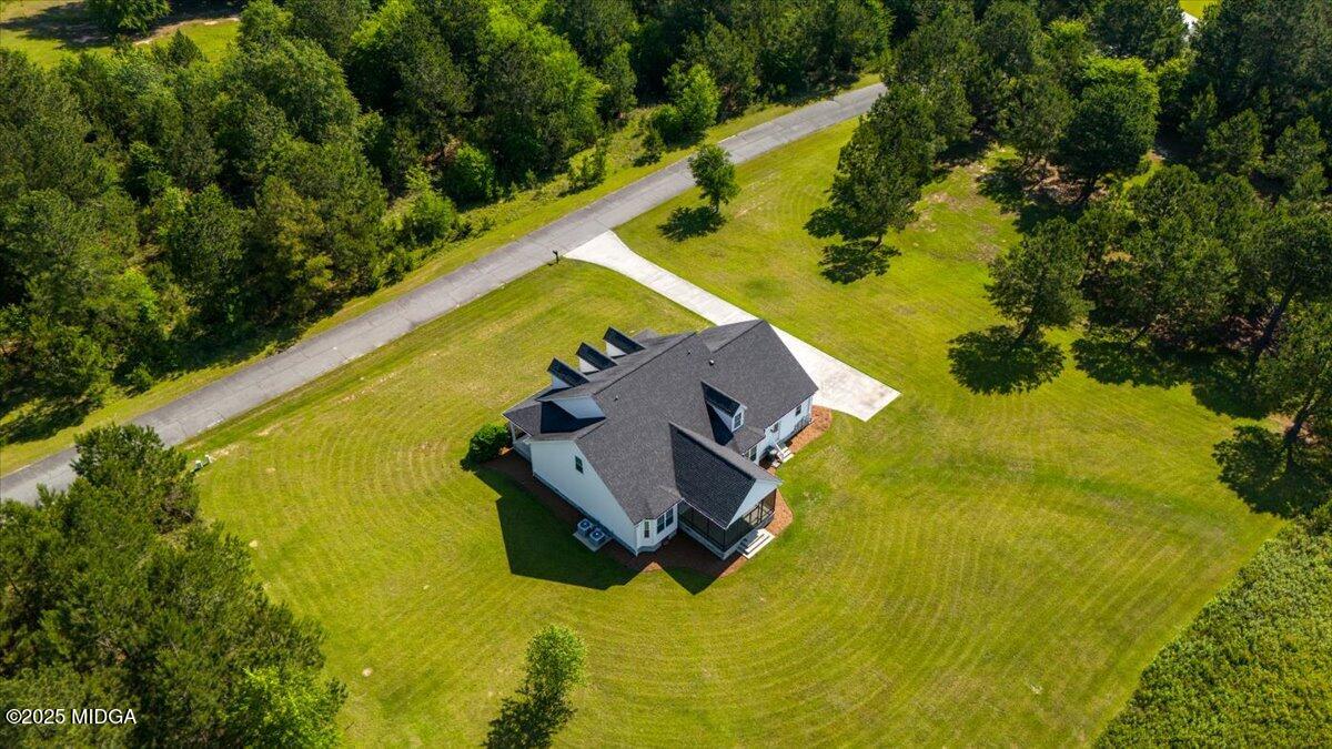 236 Woodland Trail Road Cochran, GA 31014 - Photo 6 of 13 an aerial view of a swimming pool with lawn chairs and large trees