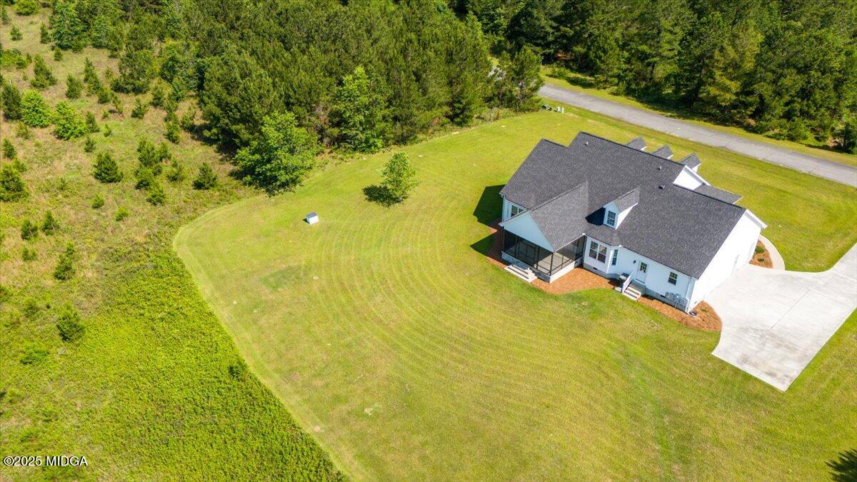 236 Woodland Trail Road Cochran, GA 31014 - Photo 8 of 13 an aerial view of residential houses with swimming pool