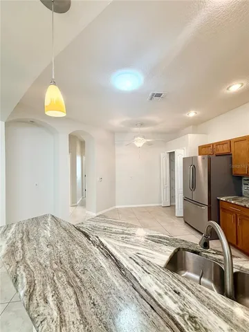 a bedroom with a bed and a sink