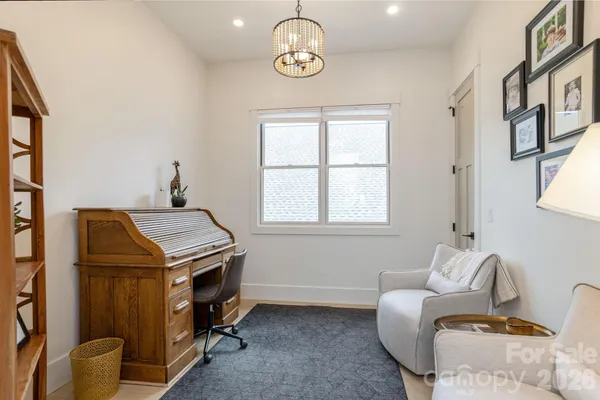 a view of a livingroom with furniture and windows