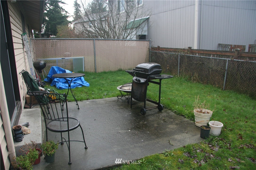 15 Madison Street Everett, WA 98203 - Photo 8 of 8 a view of a chairs and table in backyard