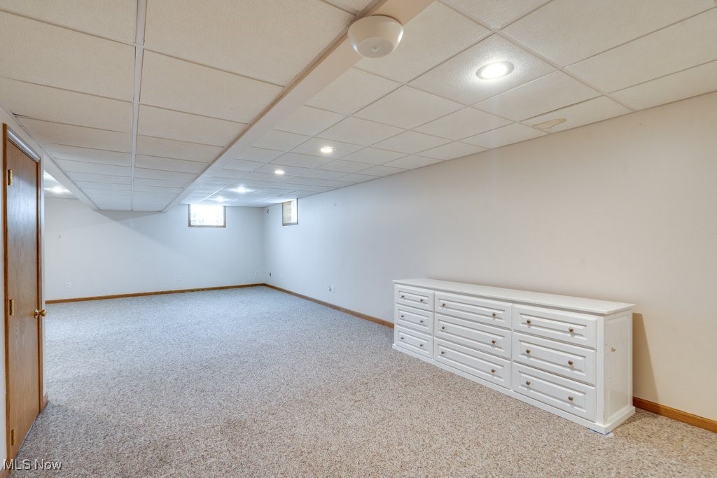 5613 Stoney Ridge Road Northwest Canton, OH 44718 - Photo 27 of 39 Below grade area featuring a drop ceiling, carpet flooring, and recessed lighting