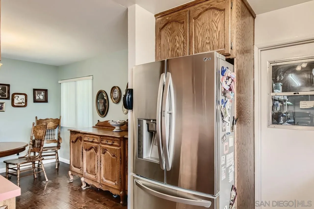 10027 Pebble Beach Drive Santee, CA 92071 - Photo 13 of 25 a kitchen with stainless steel appliances granite countertop a refrigerator and a sink
