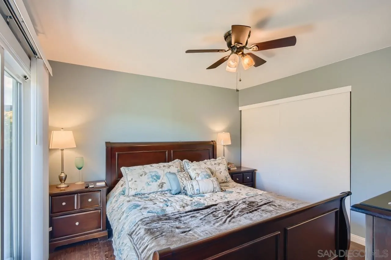 10027 Pebble Beach Drive Santee, CA 92071 - Photo 14 of 25 a bed sitting in a bedroom next to a window