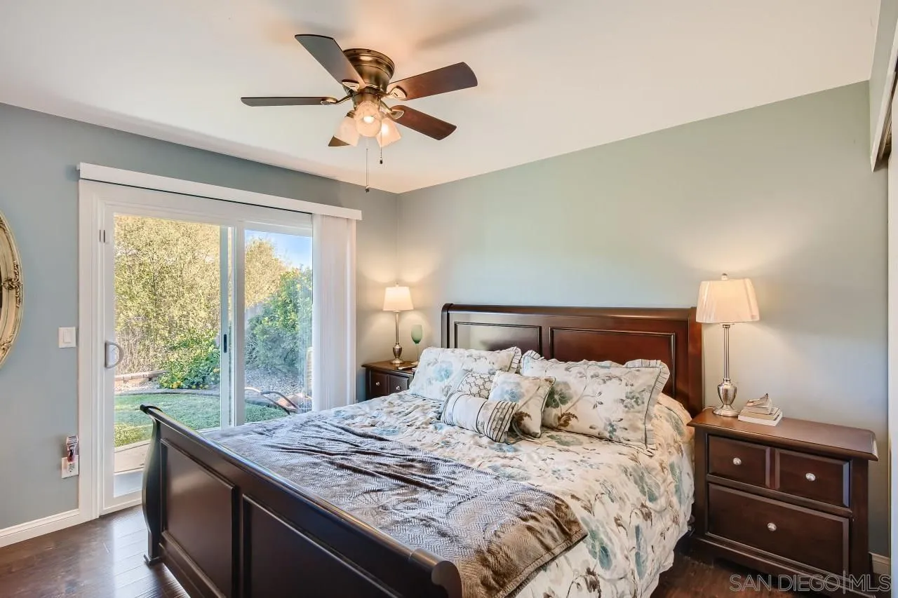 10027 Pebble Beach Drive Santee, CA 92071 - Photo 15 of 25 a bed sitting in a bedroom next to a window