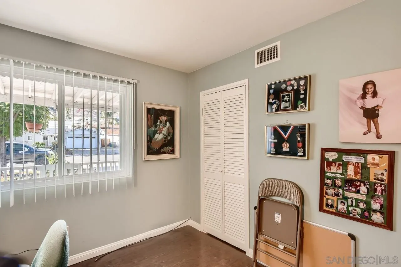 10027 Pebble Beach Drive Santee, CA 92071 - Photo 21 of 25 a view of a livingroom with shelves and workspace