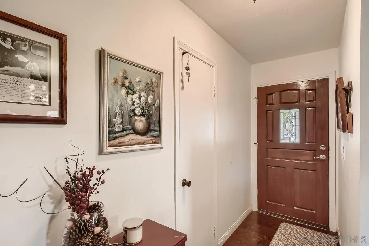 10027 Pebble Beach Drive Santee, CA 92071 - Photo 5 of 25 a view of a hallway with paintings on the wall