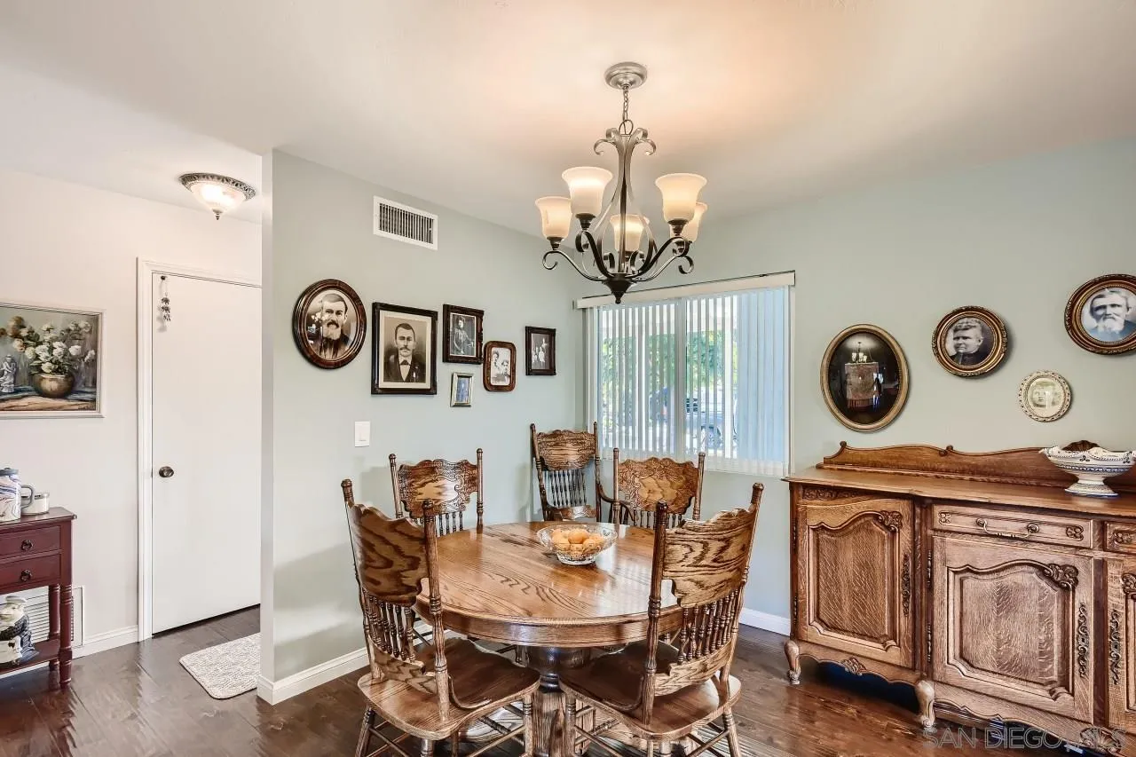 10027 Pebble Beach Drive Santee, CA 92071 - Photo 10 of 25 a view of a dining room with furniture wooden floor and a clock