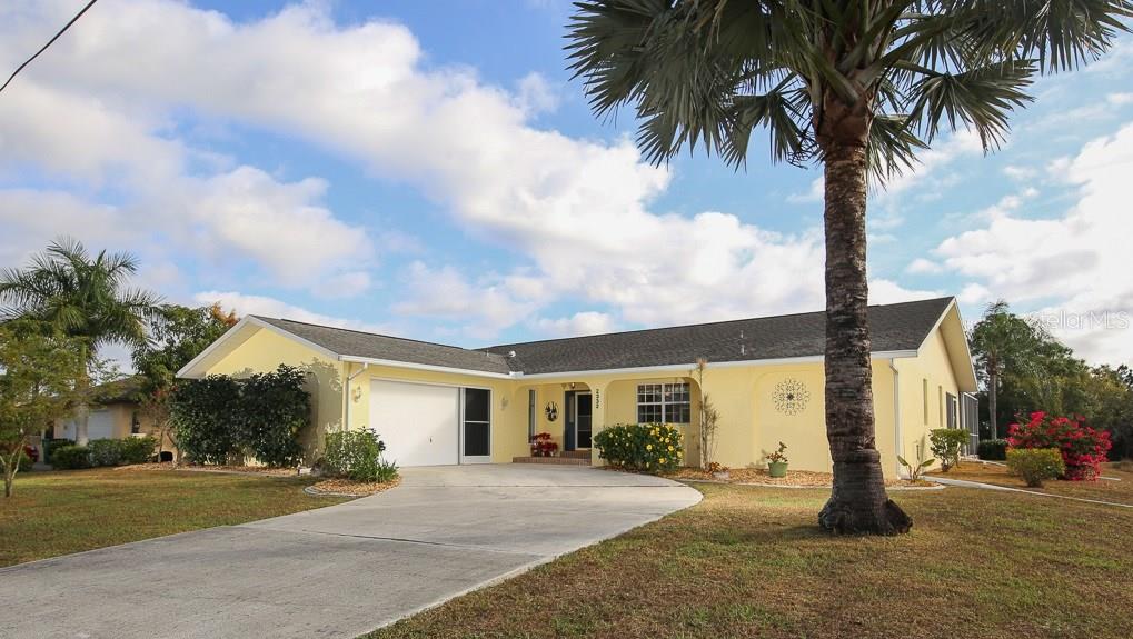 2332 Mauritania Road Punta Gorda, FL 33983 - Photo 1 of 1 Classic styling in sunny yellow with side entry garage