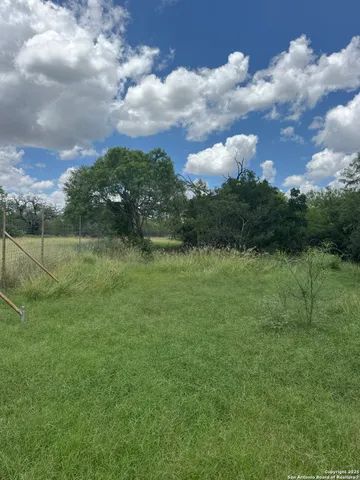 a view of a lake with a big yard