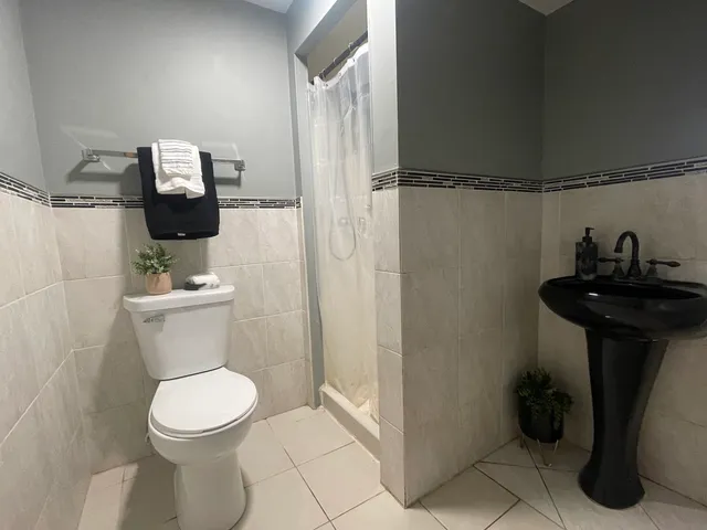 a bathroom with a toilet and a sink
