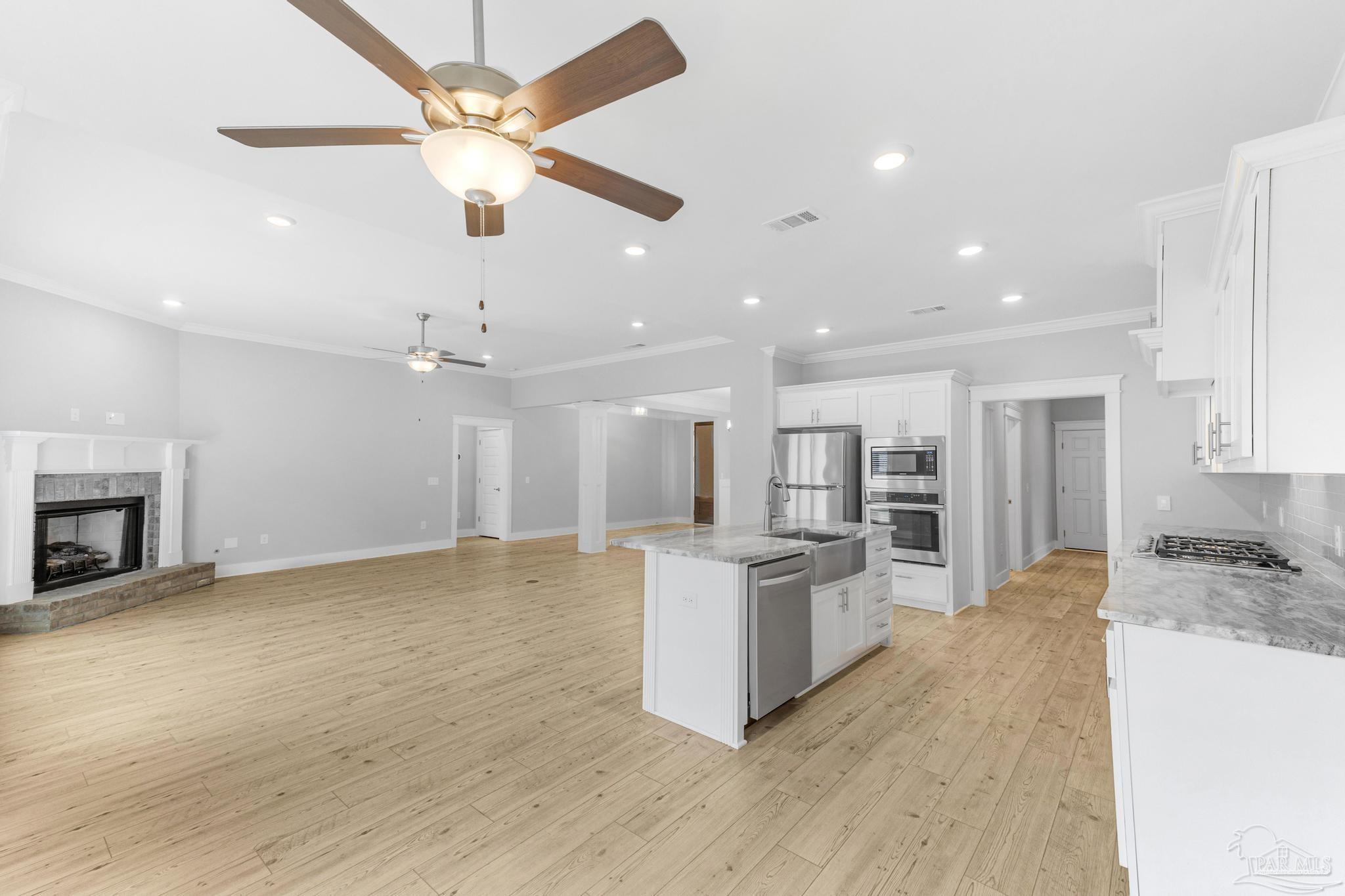 6264 Howie Way Pace, FL 32571 - Photo 11 of 42 a view of kitchen with sink and microwave