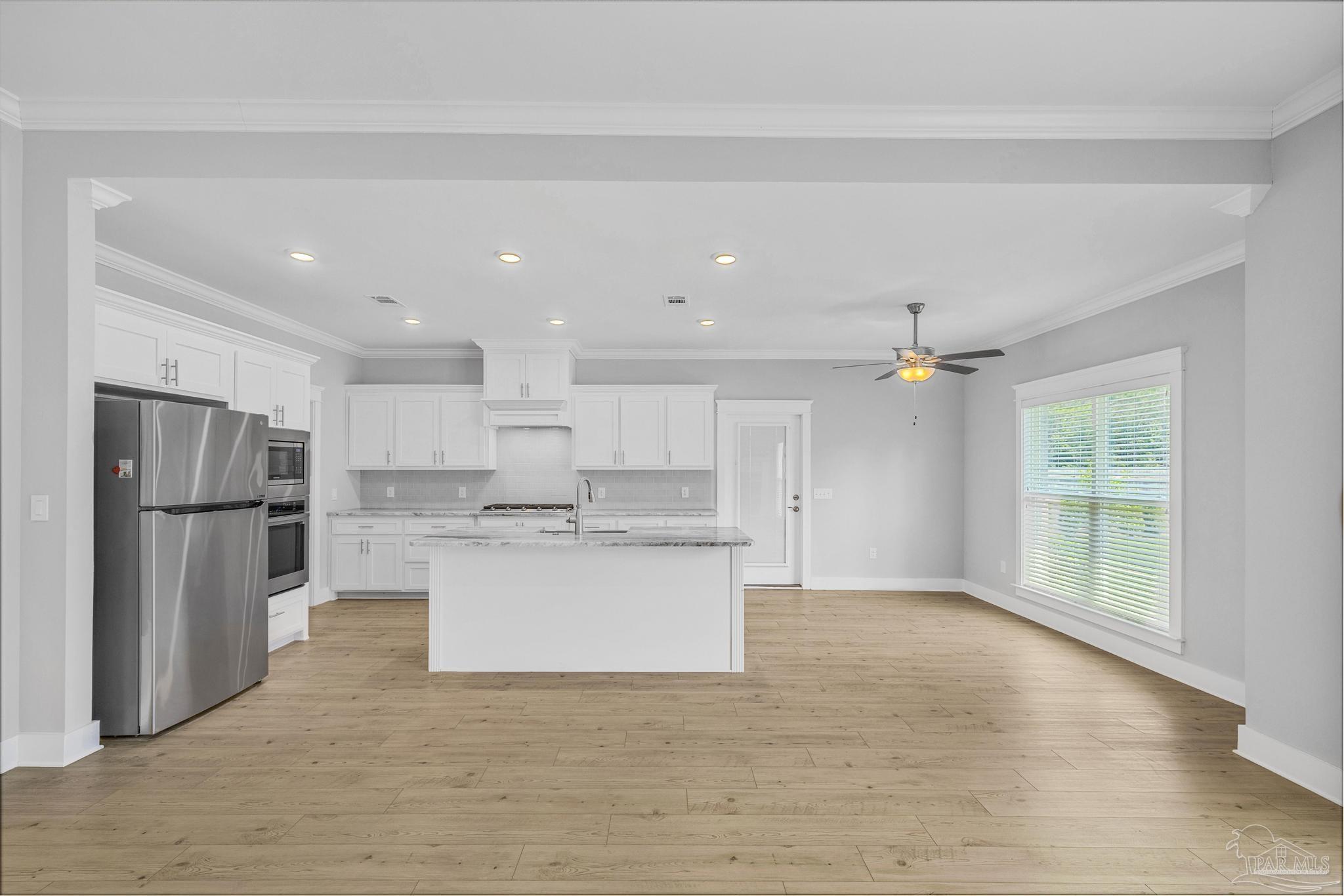 6264 Howie Way Pace, FL 32571 - Photo 14 of 42 a view of kitchen with wooden floor and electronic appliances