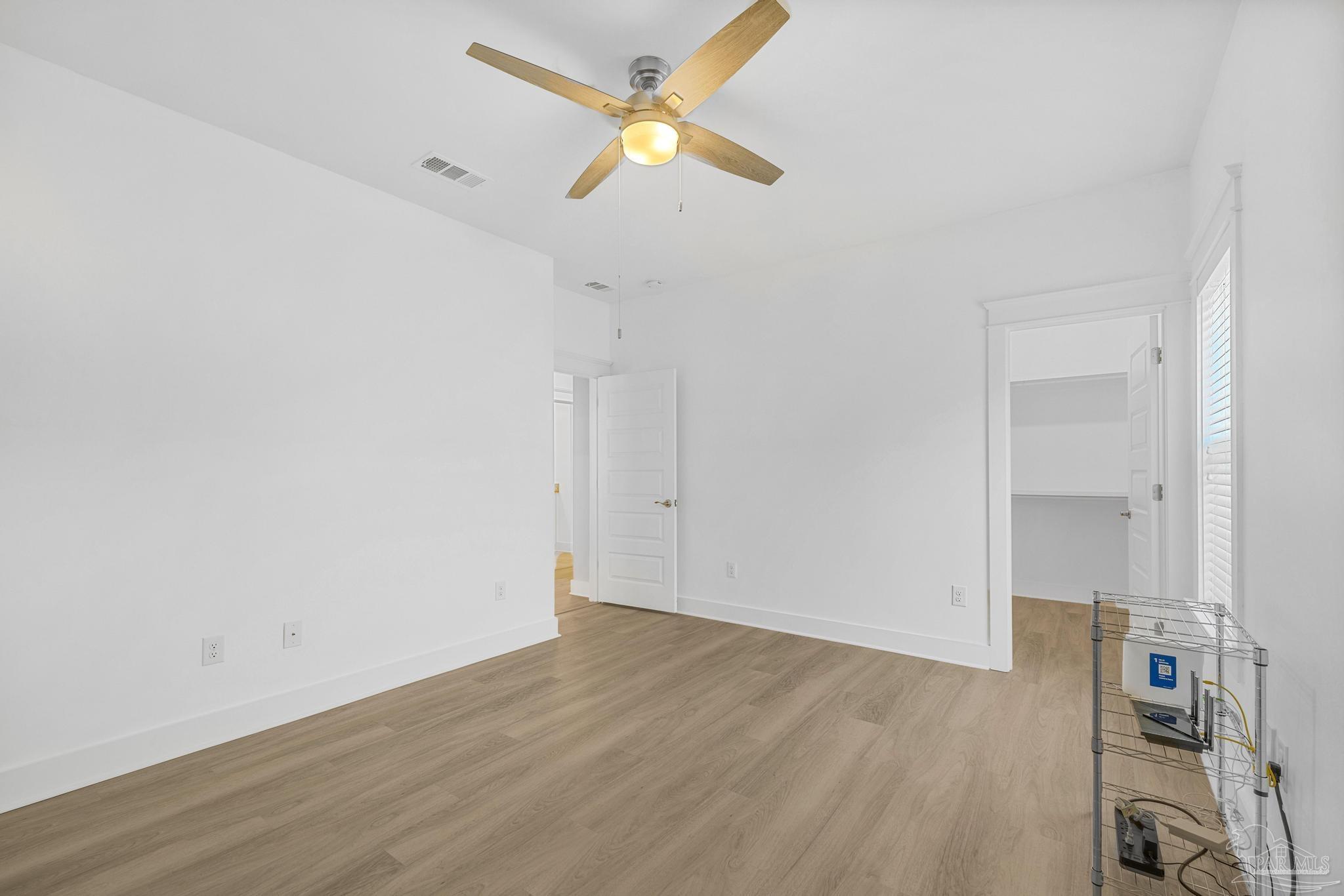 6264 Howie Way Pace, FL 32571 - Photo 20 of 42 wooden floor in an empty room