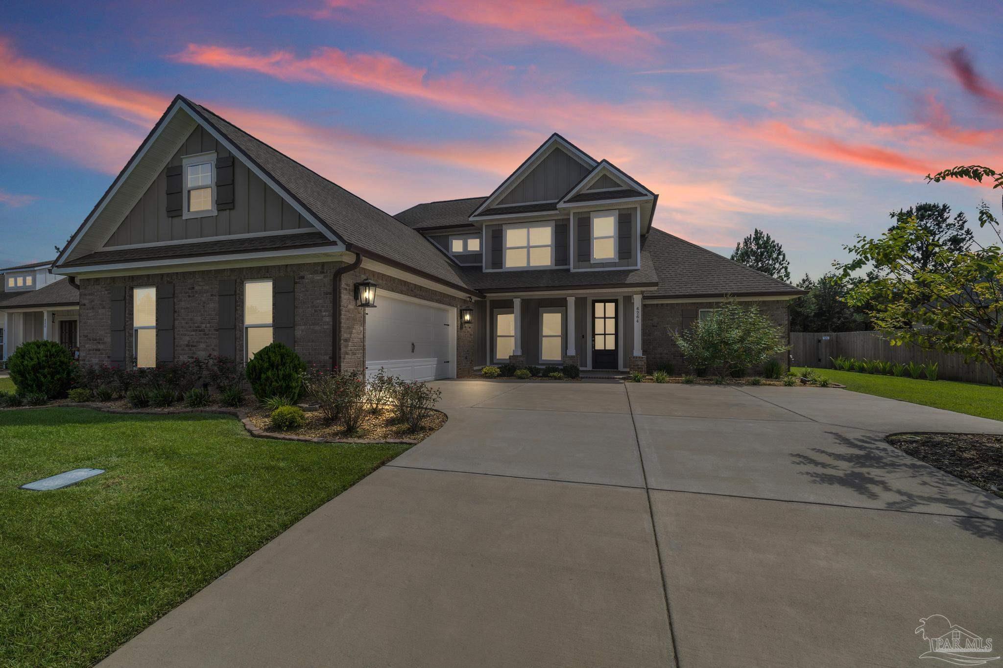 6264 Howie Way Pace, FL 32571 - Photo 2 of 42 a front view of a house with a yard