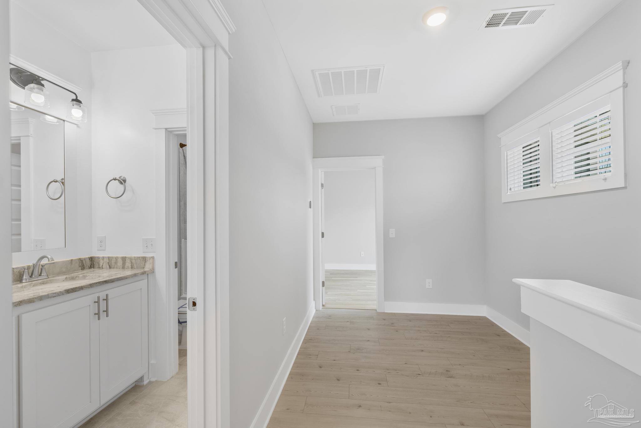 6264 Howie Way Pace, FL 32571 - Photo 23 of 42 a bathroom with a sink a toilet and shower