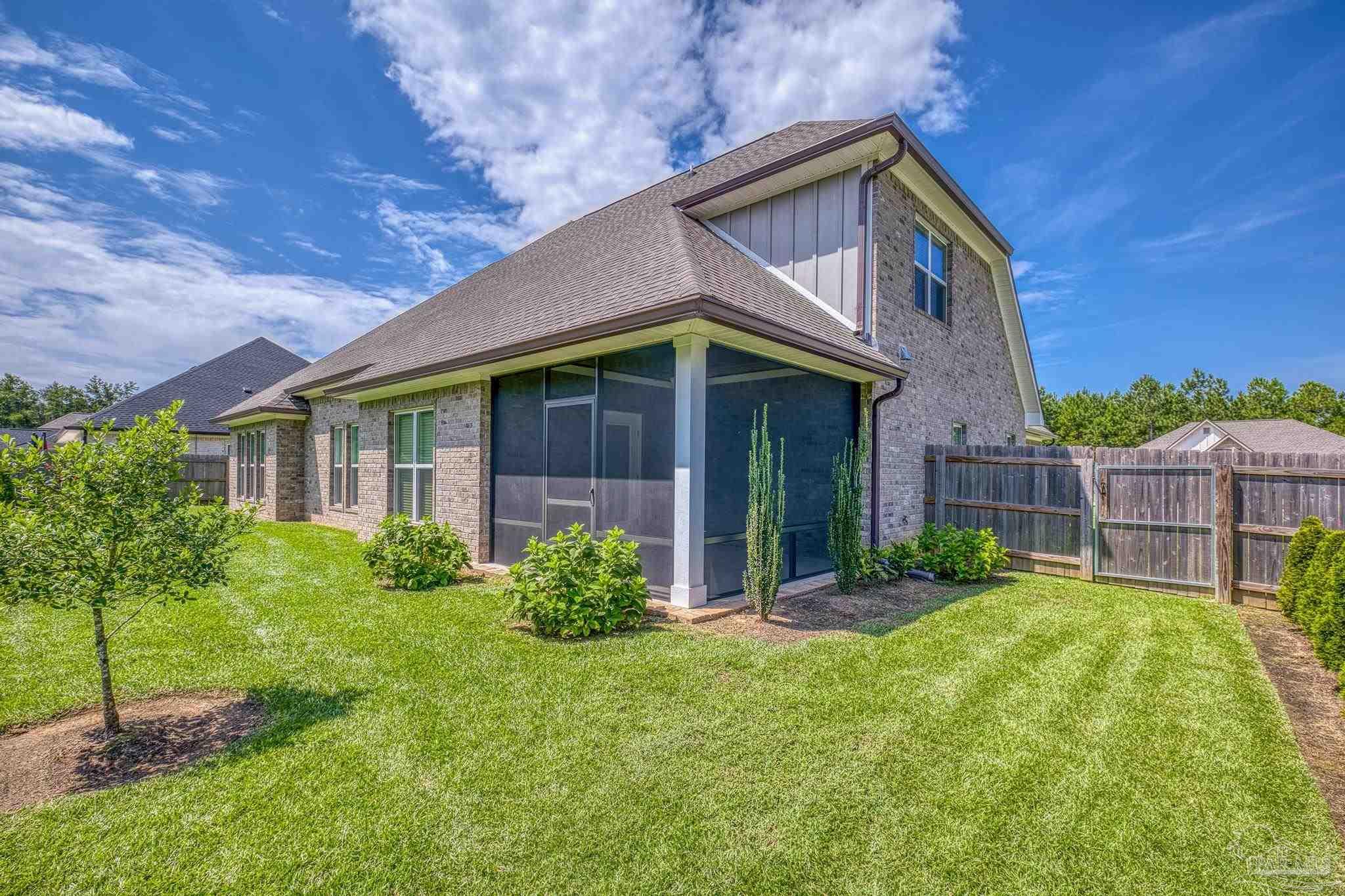 6264 Howie Way Pace, FL 32571 - Photo 30 of 42 a front view of a house with a yard