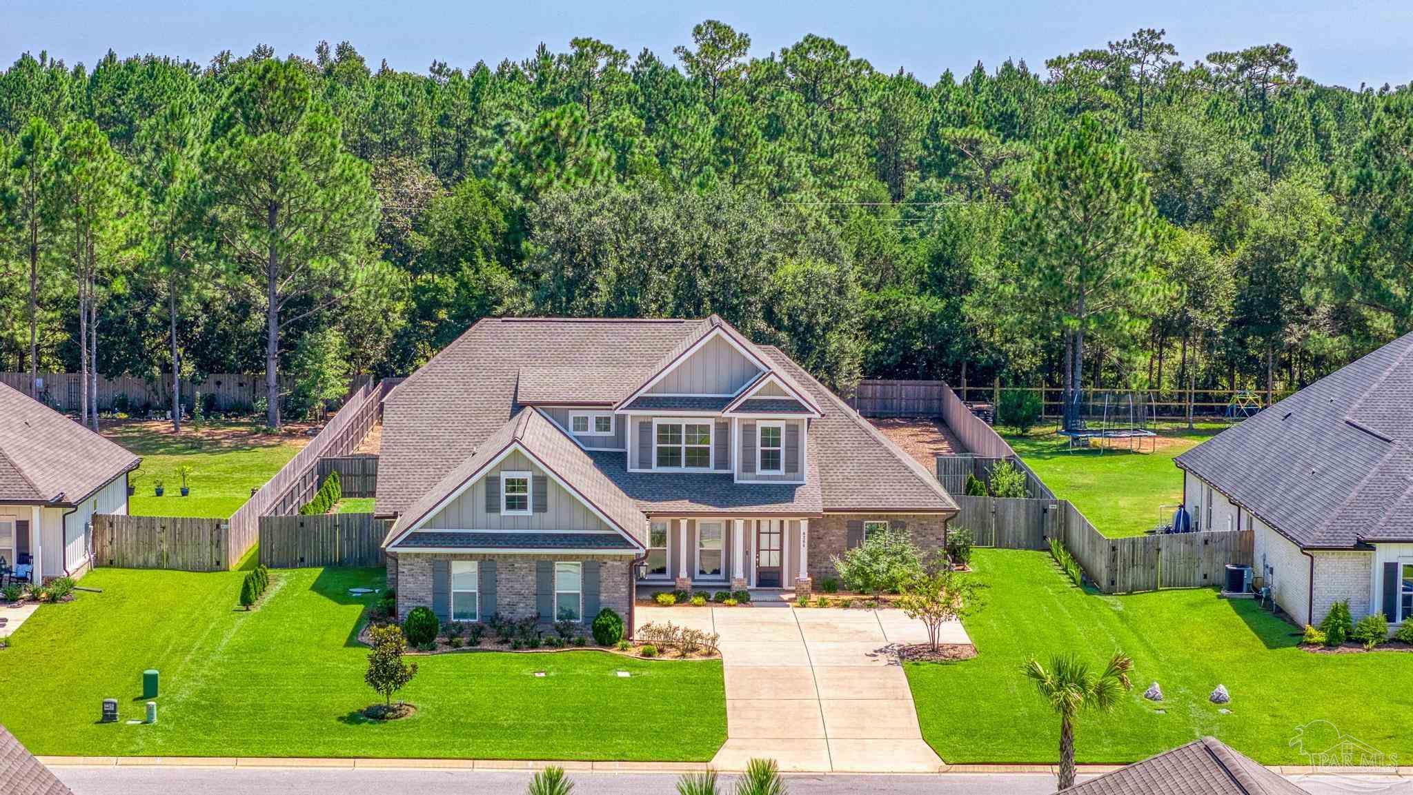 6264 Howie Way Pace, FL 32571 - Photo 37 of 42 a front view of house with yard and green space