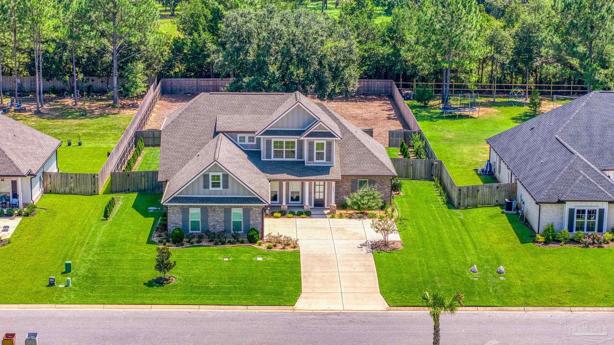 6264 Howie Way Pace, FL 32571 - Photo 38 of 42 a view of a house with a park